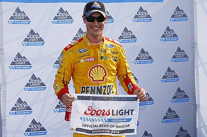 Logano takes Michigan pole, Harvick bit by cautions