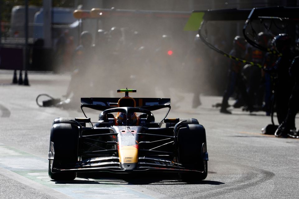 Sergio Perez, Red Bull Racing RB20, in the pit lane 