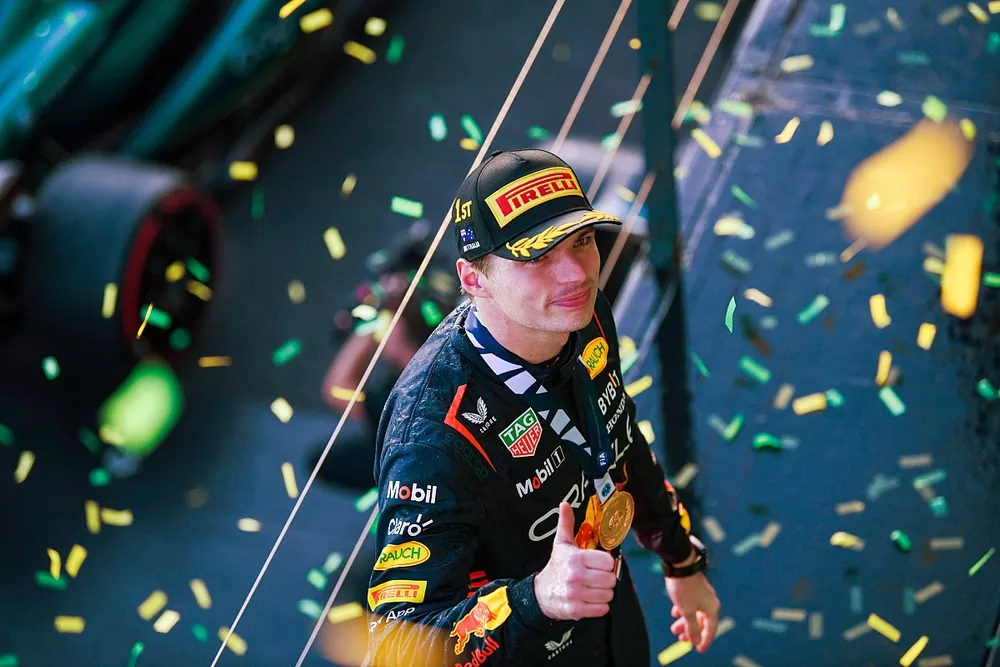 Max Verstappen, Red Bull Racing, 1st position, with his medal on the podium