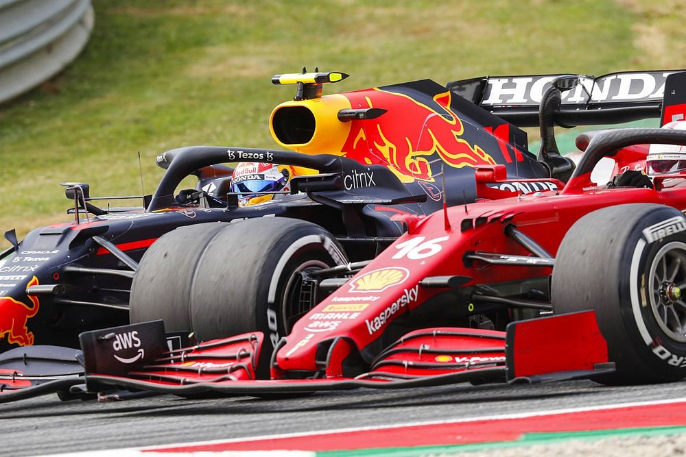 Sergio Perez, Red Bull Racing RB16B, battles with Charles Leclerc, Ferrari SF21