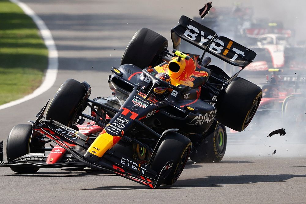 Charles Leclerc, Ferrari SF-23, Sergio Perez, Red Bull Racing RB19, make contact at the start causing the Mexican to crash out