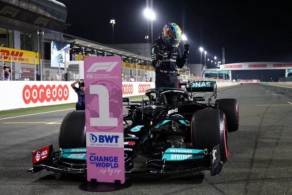 Lewis Hamilton, Mercedes, celebrates on arrival in Parc Ferme after securing pole