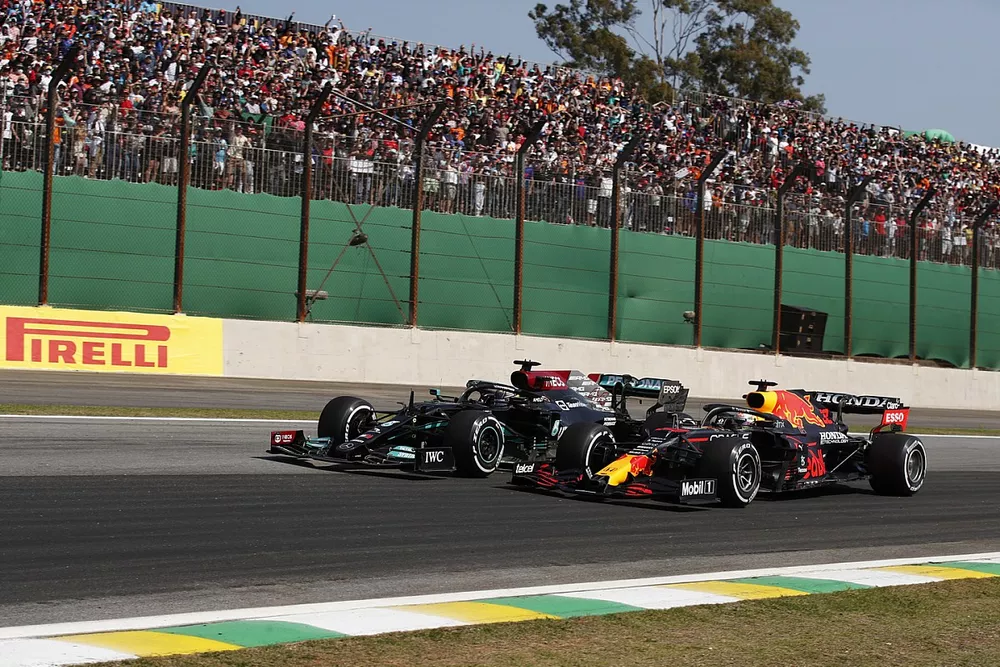 Max Verstappen, Red Bull Racing RB16B, battles with Lewis Hamilton, Mercedes W12