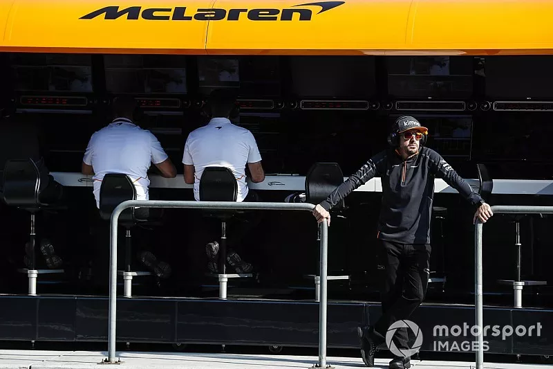 Fernando Alonso, McLaren, stands on the gantry 