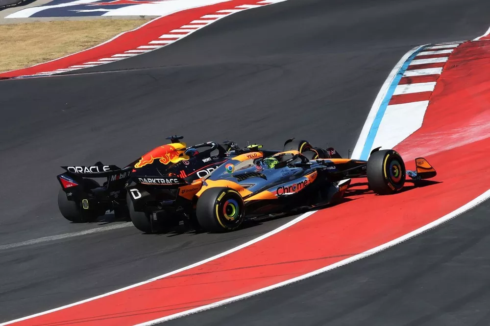 Max Verstappen, Red Bull Racing RB20, Lando Norris, McLaren MCL38, battle into turn 1