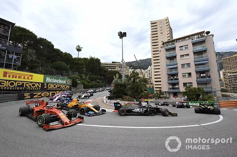 Romain Grosjean, Haas F1 Team VF-19, leads Charles Leclerc, Ferrari SF90, Lando Norris, McLaren MCL34, and Lance Stroll, Racing Point RP19