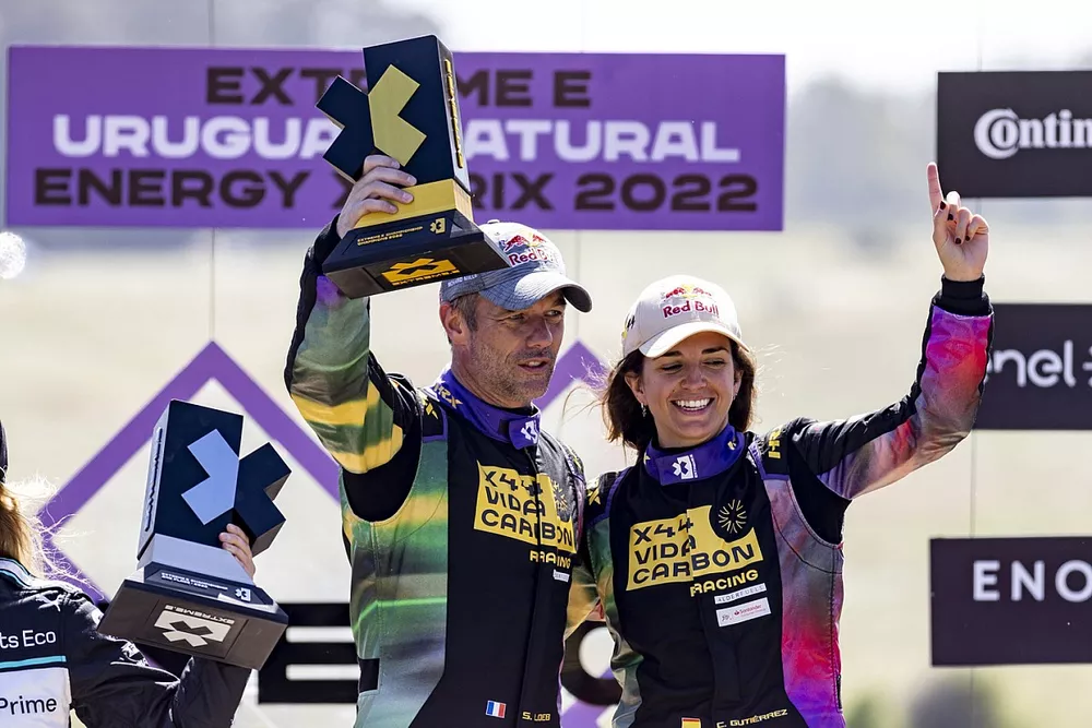 Sebastien Loeb, Team X44, and Cristina Gutierrez, Team X44, on the podium