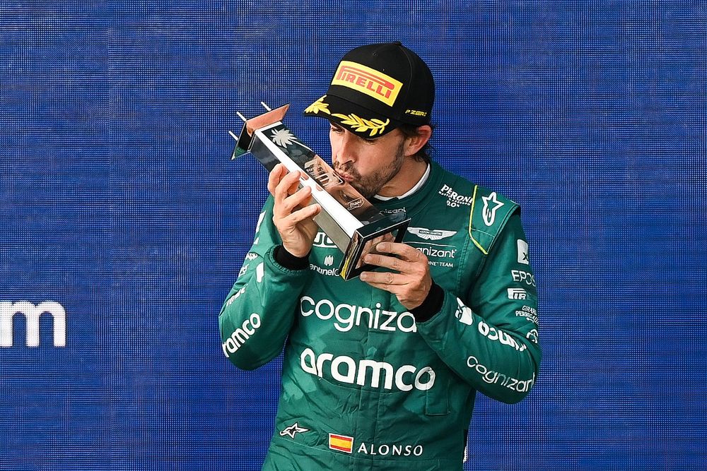 Fernando Alonso, Aston Martin F1 Team, 3rd position, kisses his trophy on the podium