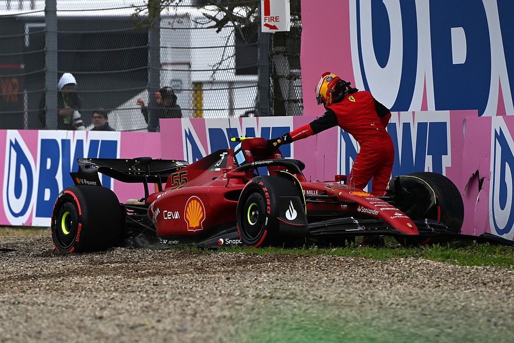 Carlos Sainz Jr., Ferrari F1-75, climbs out of his car after crashing out in Q2