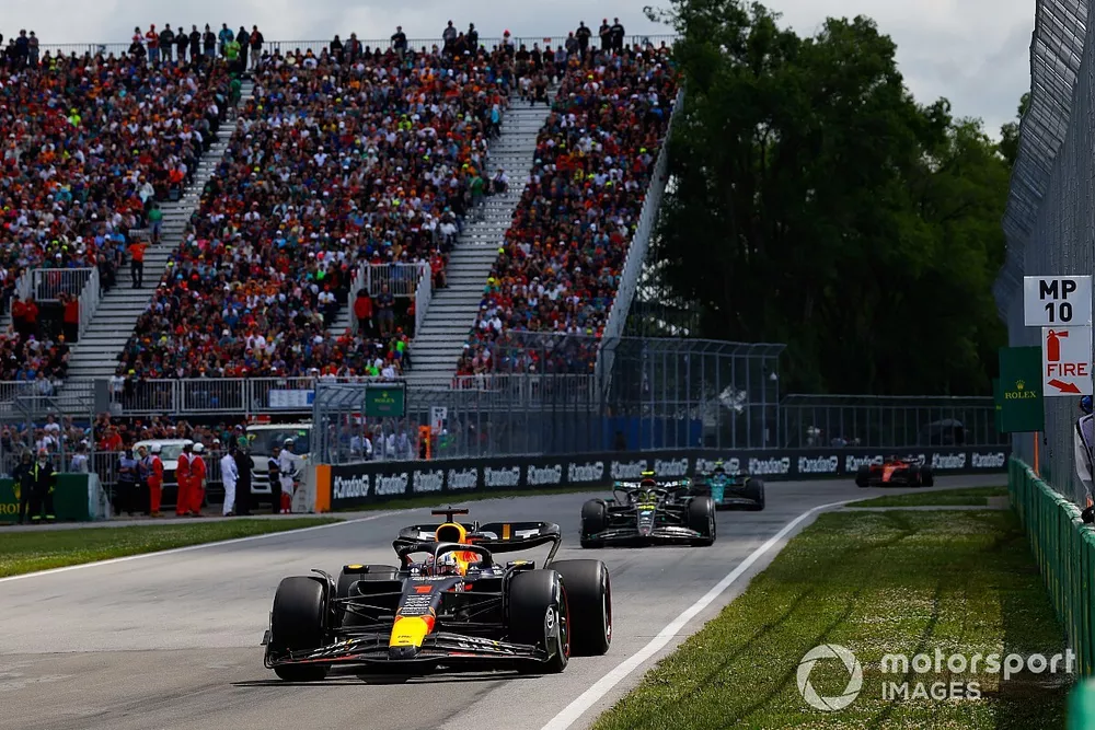 Max Verstappen, Red Bull Racing RB19, leads Sir Lewis Hamilton, Mercedes F1 W14, and Fernando Alonso, Aston Martin AMR23