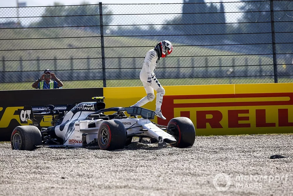 Pierre Gasly, AlphaTauri, climbs out of his car after crashing out on the opening lap