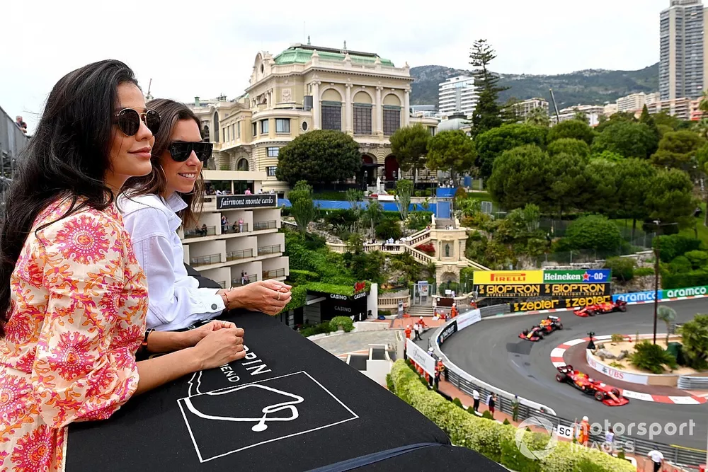 Fans watch as Charles Leclerc, Ferrari SF21, Sergio Perez, Red Bull Racing RB16B, and Carlos Sainz Jr., Ferrari SF21