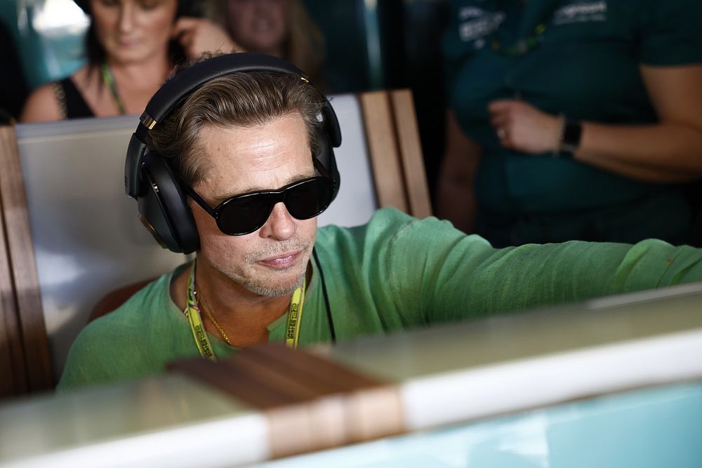 Brad Pitt in the Aston Martin garage