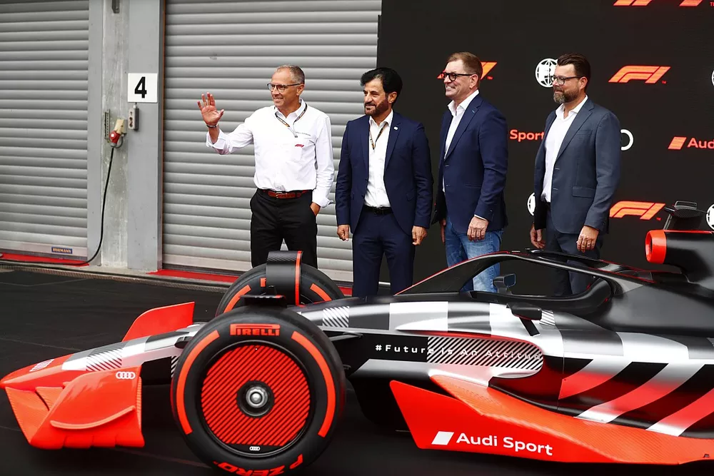 Stefano Domenicali, CEO, Formula 1, with Mohammed bin Sulayem, President, FIA, Markus Duesmann, Chairman of the Board of Management of Audi AG, Oliver Hoffmann, Head of Technical Development at Audi Sport GmbH showcase the new Audi Sport F1 concept car