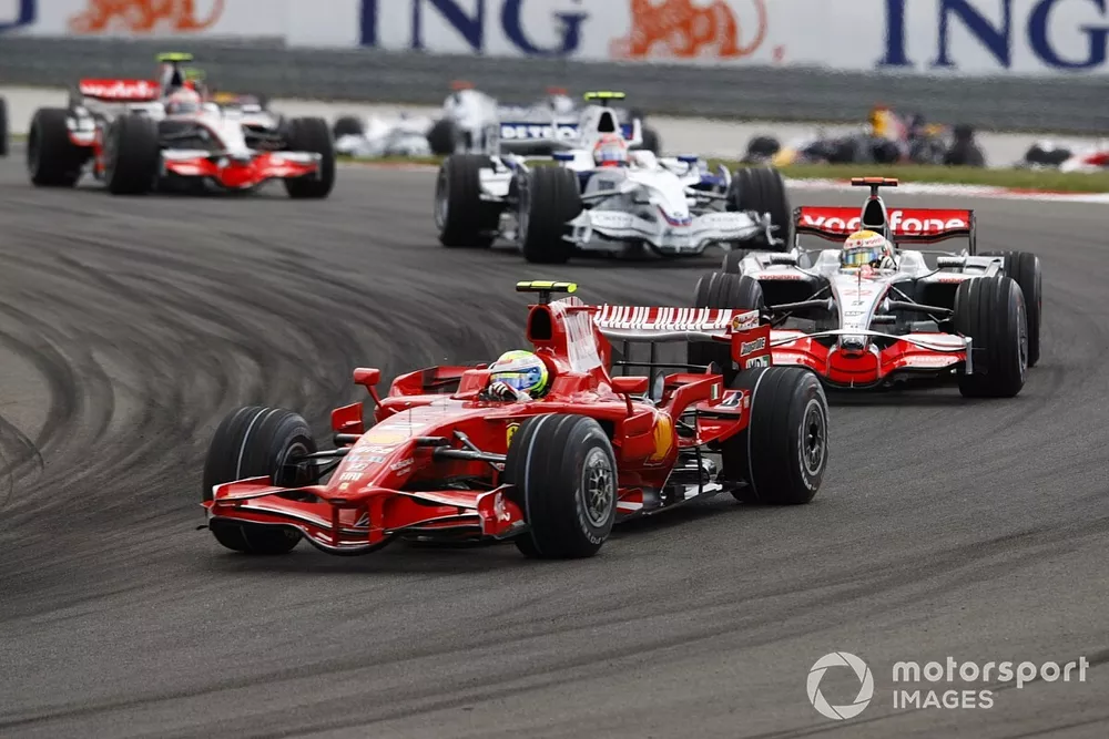Felipe Massa, Ferrari F2008, leads Lewis Hamilton, McLaren MP4-23 Mercedes, and Robert Kubica, BMW Sauber F1.08