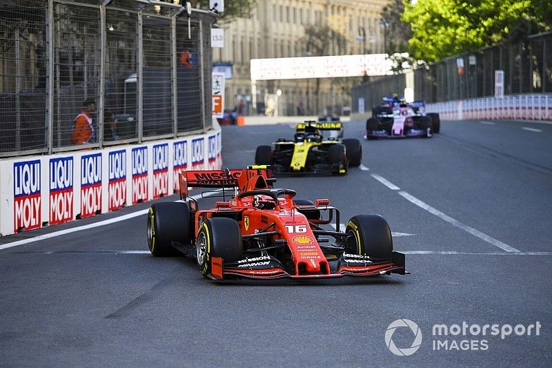 Charles Leclerc, Ferrari SF90, leads Daniel Ricciardo, Renault R.S.19, and Lance Stroll, Racing Point RP19