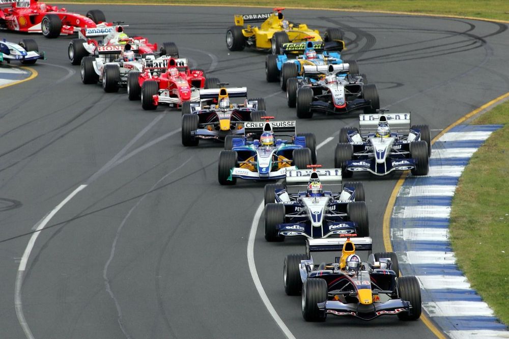 First corner action: David Coulthard leads the pack