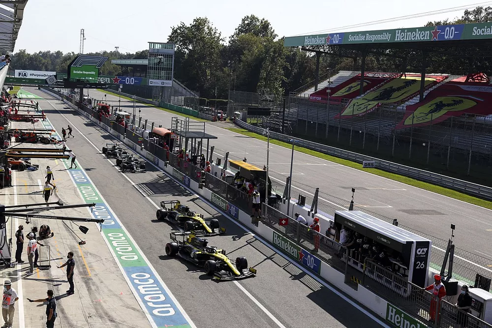 Daniel Ricciardo, Renault F1 Team R.S.20, and Esteban Ocon, Renault F1 Team R.S.20, leave the pits