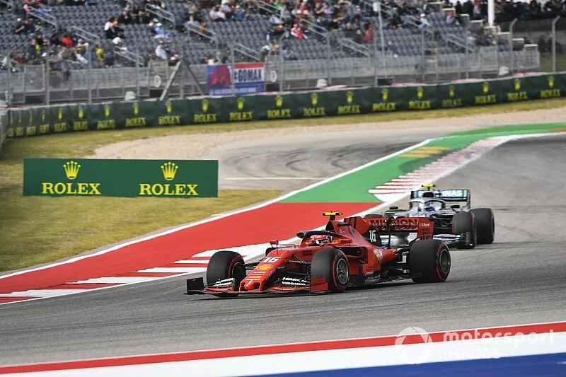 Charles Leclerc, Ferrari SF90, leads Valtteri Bottas, Mercedes AMG W10