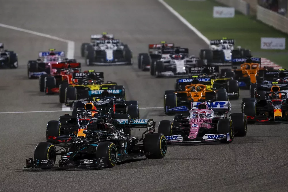 Lewis Hamilton, Mercedes F1 W11, Sergio Perez, Racing Point RP20 and Max Verstappen, Red Bull Racing RB16 at the start of the race