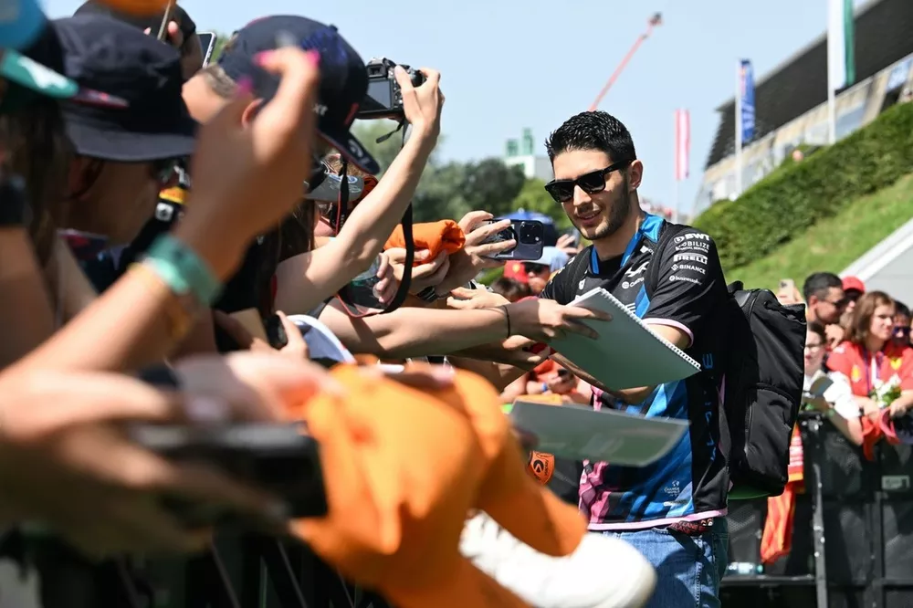 Esteban Ocon, Alpine F1 Team, signs autographs for fans