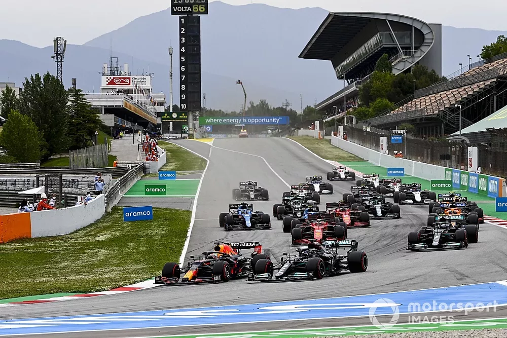 Max Verstappen, Red Bull Racing RB16B and Lewis Hamilton, Mercedes W12 battle at the start of the race