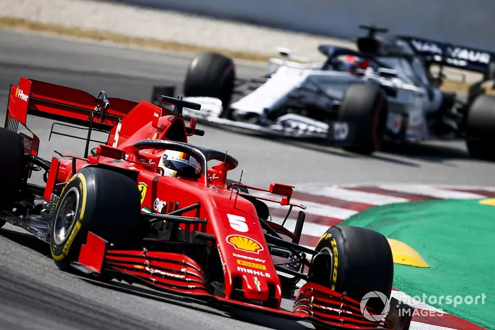 Sebastian Vettel, Ferrari SF1000, leads Daniil Kvyat, AlphaTauri AT01