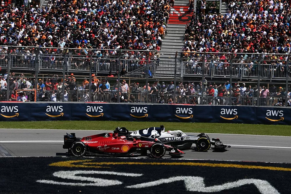 Pierre Gasly, AlphaTauri AT03, battles with Charles Leclerc, Ferrari F1-75
