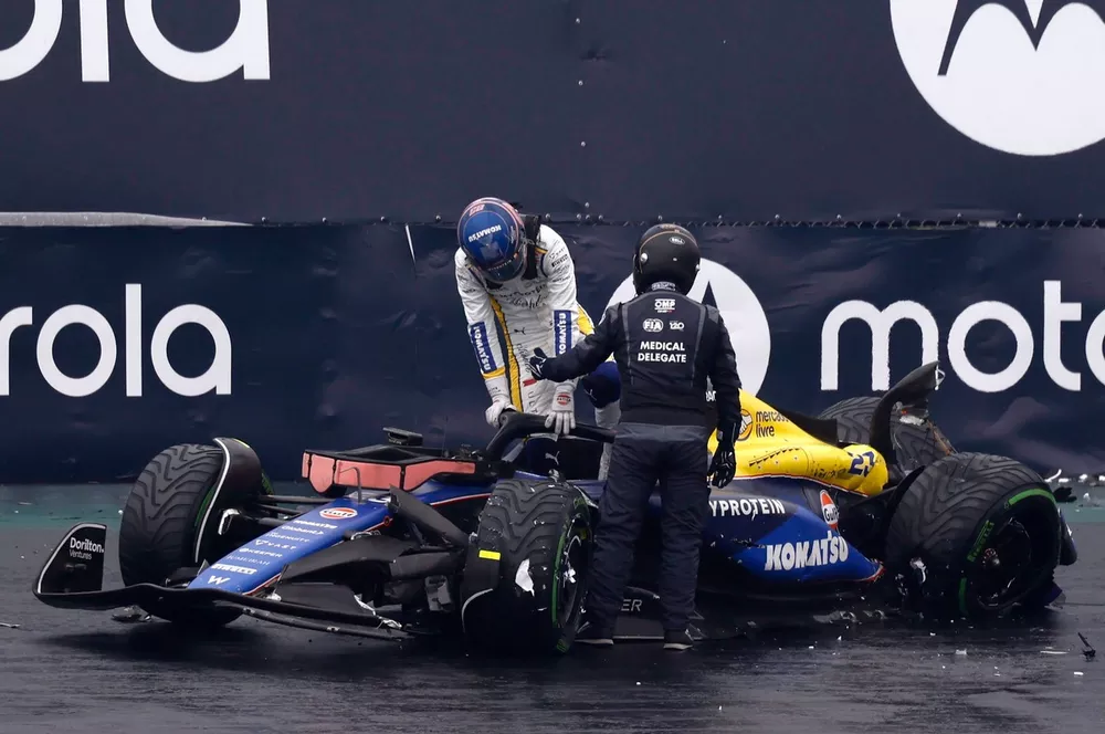Alex Albon, Williams FW46, gets out of the car after crashing out of Qualifying