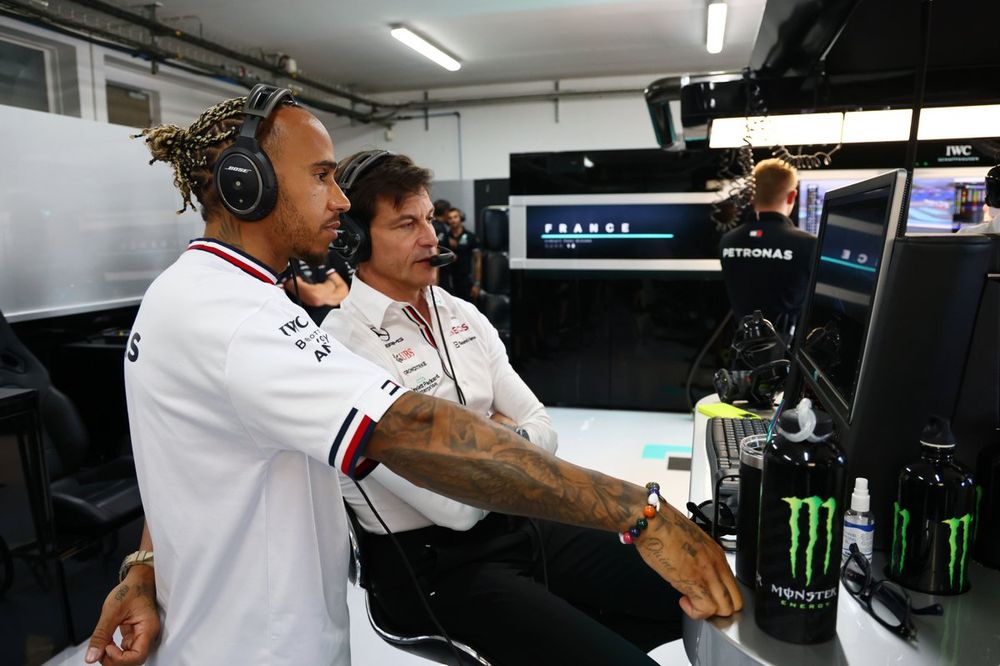 Sir Lewis Hamilton, Mercedes-AMG, watches on with Toto Wolff, Team Principal and CEO, Mercedes AMG