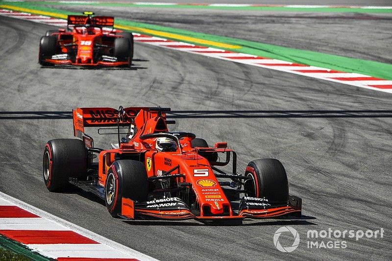 Sebastian Vettel, Ferrari SF90, leads Charles Leclerc, Ferrari SF90