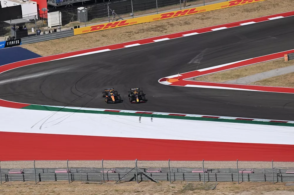 Lando Norris, McLaren MCL38, battles with Max Verstappen, Red Bull Racing RB20