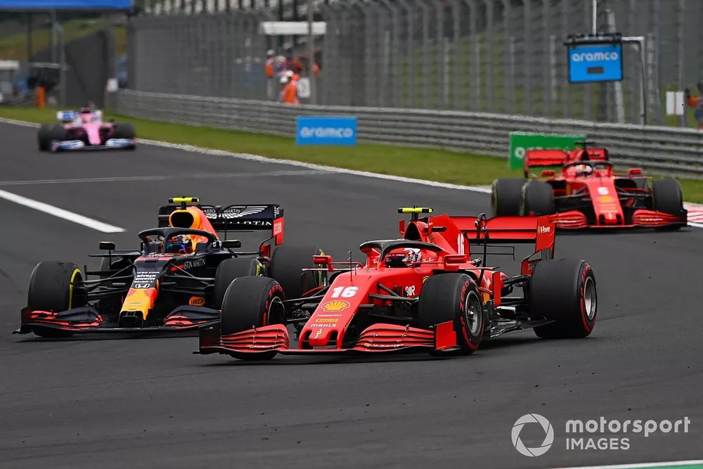 Charles Leclerc, Ferrari SF1000, battles with Alex Albon, Red Bull Racing RB16, ahead of Sebastian Vettel, Ferrari SF1000