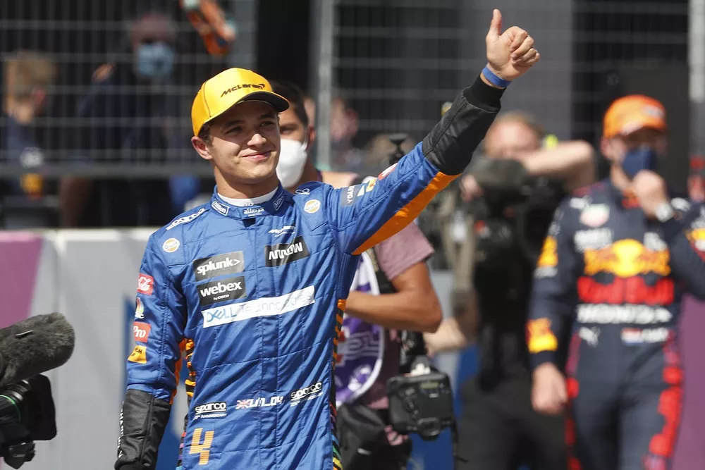 Lando Norris, McLaren, celebrates in Parc Ferme after securing a front row grid position in Qualifying