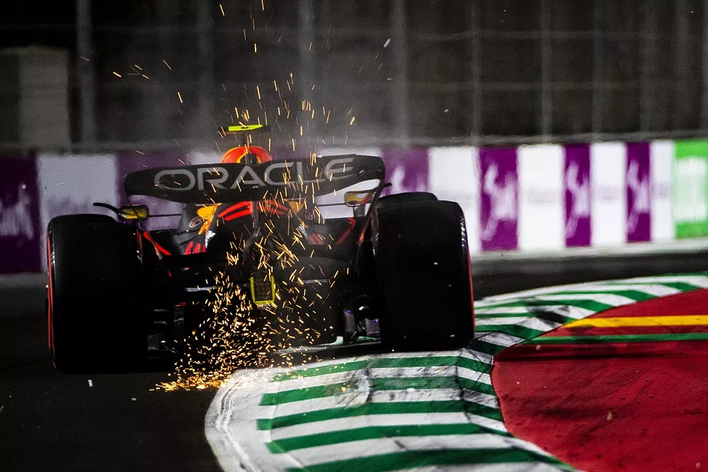 Sparks fly from Sergio Perez, Red Bull Racing RB18