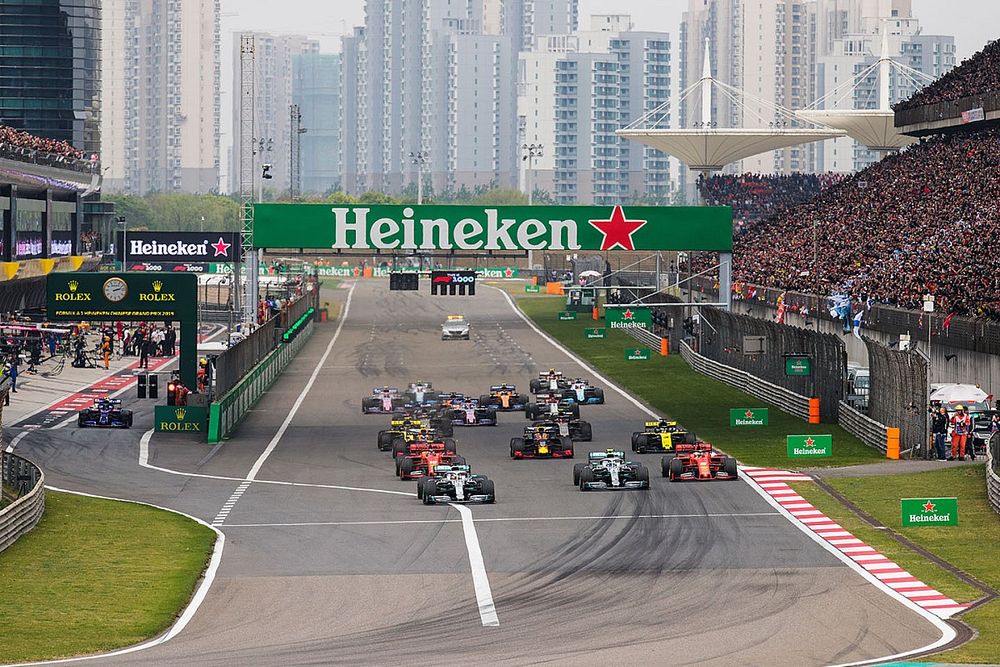 Lewis Hamilton, Mercedes AMG F1 W10, leads Valtteri Bottas, Mercedes AMG W10, Charles Leclerc, Ferrari SF90, Sebastian Vettel, Ferrari SF90, Max Verstappen, Red Bull Racing RB15, and the rest of the field towards the first corner