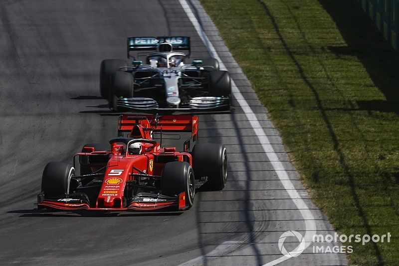 Sebastian Vettel, Ferrari SF90, leads Lewis Hamilton, Mercedes AMG F1 W10