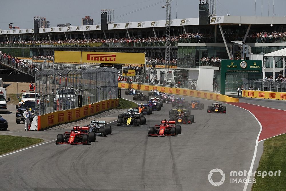 Sebastian Vettel, Ferrari SF90, leads Lewis Hamilton, Mercedes AMG F1 W10, Charles Leclerc, Ferrari SF90, Daniel Ricciardo, Renault R.S.19, Pierre Gasly, Red Bull Racing RB15, and the rest of the field at the start