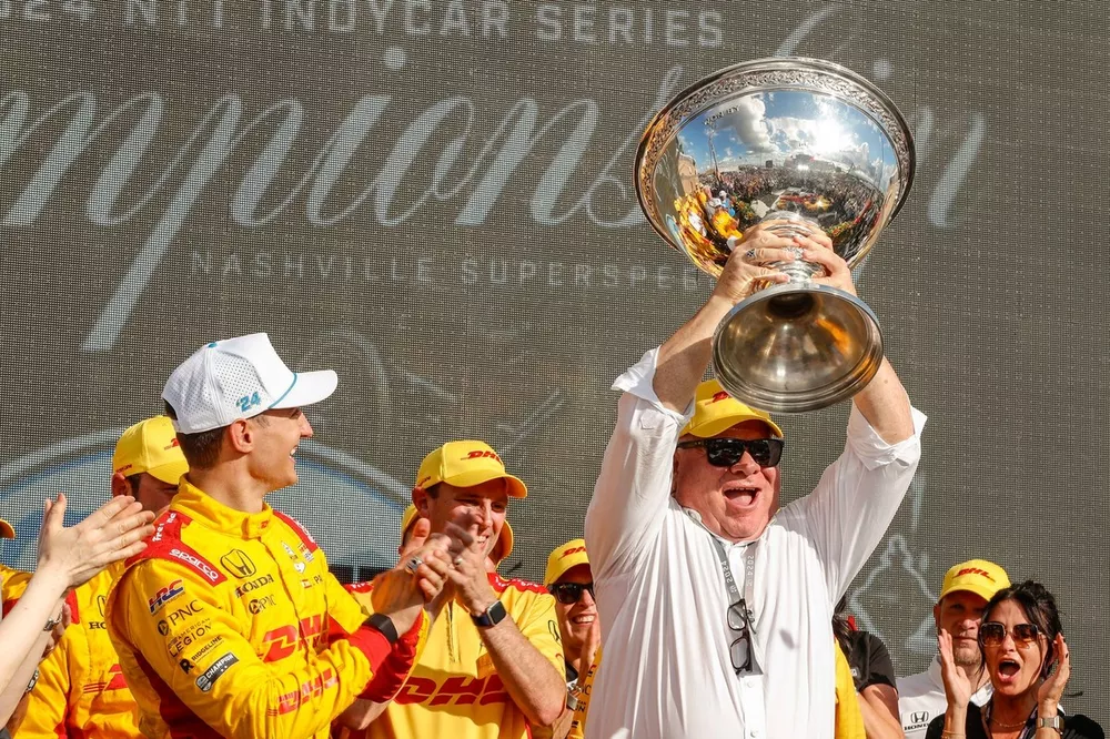 Alex Palou, Chip Ganassi Racing Honda team owner hoists the Astor Challenge Cup after winning the 2024 IndyCar championship