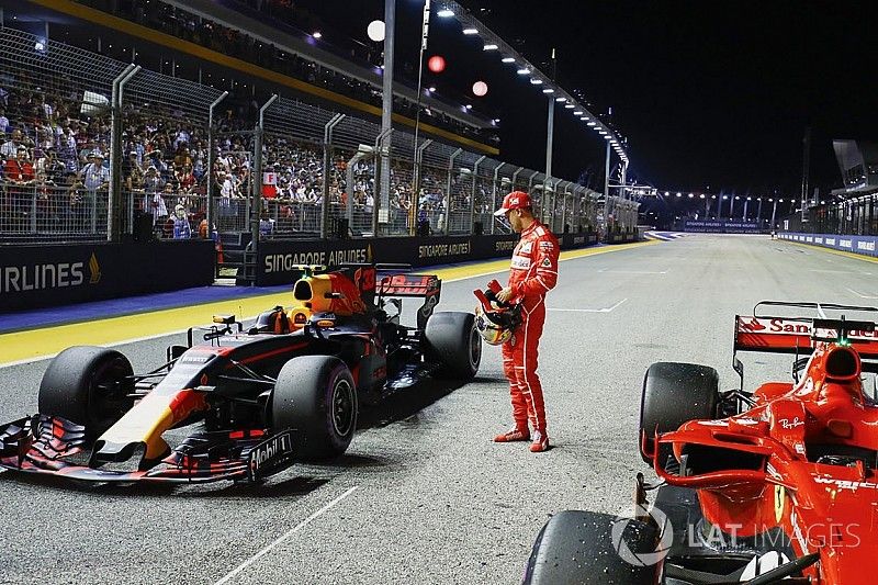 Pole sitter Sebastian Vettel, Ferrari, inspects the Redbull