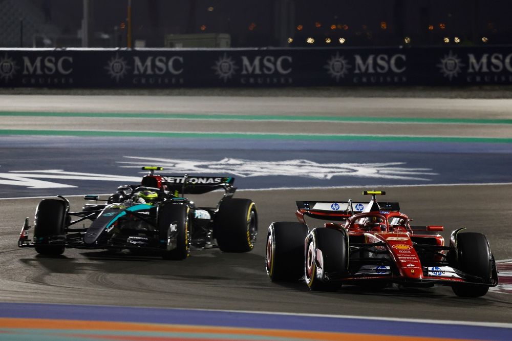 Carlos Sainz, Ferrari SF-24, leads Lewis Hamilton, Mercedes F1 W15