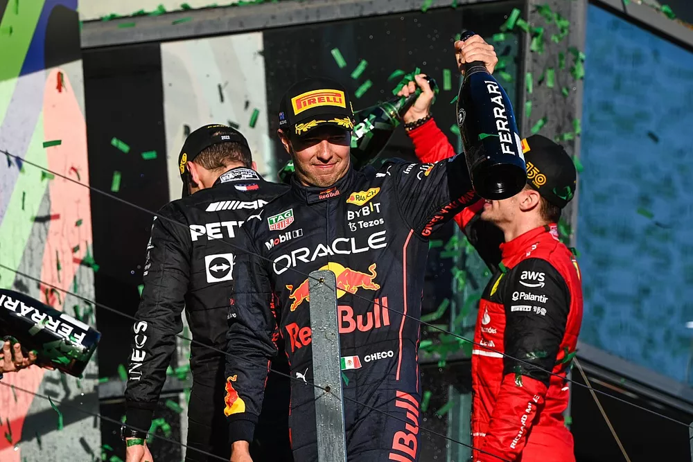 Sergio Perez, Red Bull Racing, 2nd position, celebrates with Champagne
