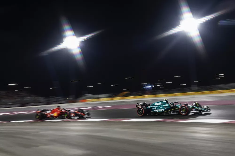 Fernando Alonso, Aston Martin AMR23, leads Charles Leclerc, Ferrari SF-23