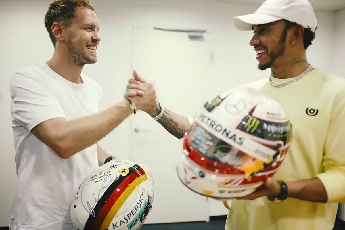 Vettel, Hamilton exchange helmets after F1 finale