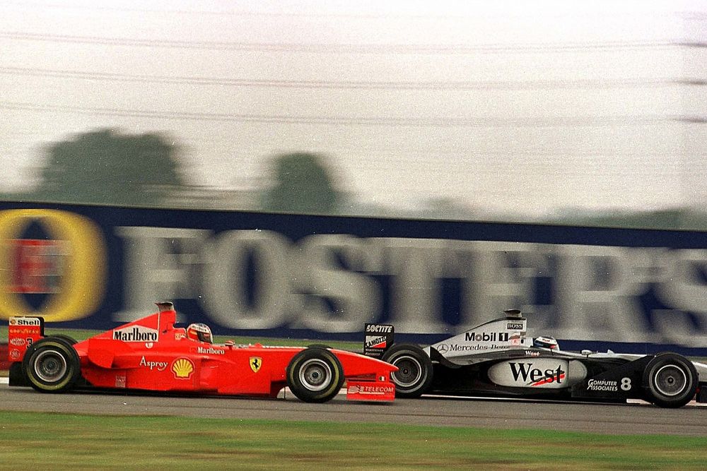 Micheal Schumacher, Ferrari, overtakes Mika Hakkinen, McLaren Mercedes