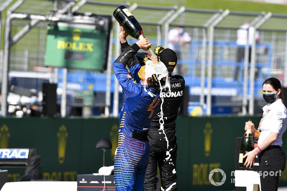 Lando Norris, McLaren celebrates with the champagne on the podium