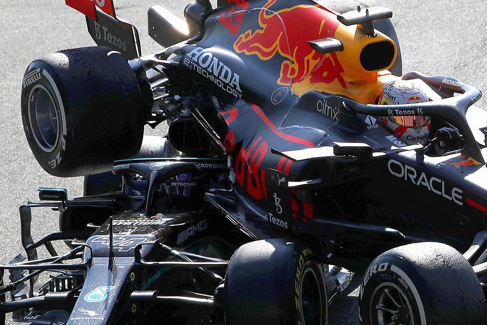 Max Verstappen, Red Bull Racing RB16B, and Lewis Hamilton, Mercedes W12, crash out