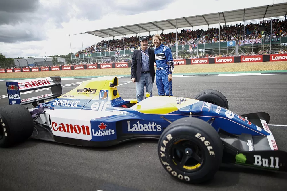 1992 World Champion Nigel Mansell with his Williams FW14B and Sebastian Vettel, Aston Martin