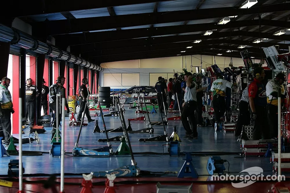 Empty garage area as the cars practice on track