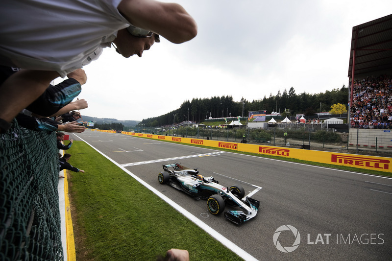 Lewis Hamilton, Mercedes AMG F1 W08, race winner, takes the chequered flag for victory